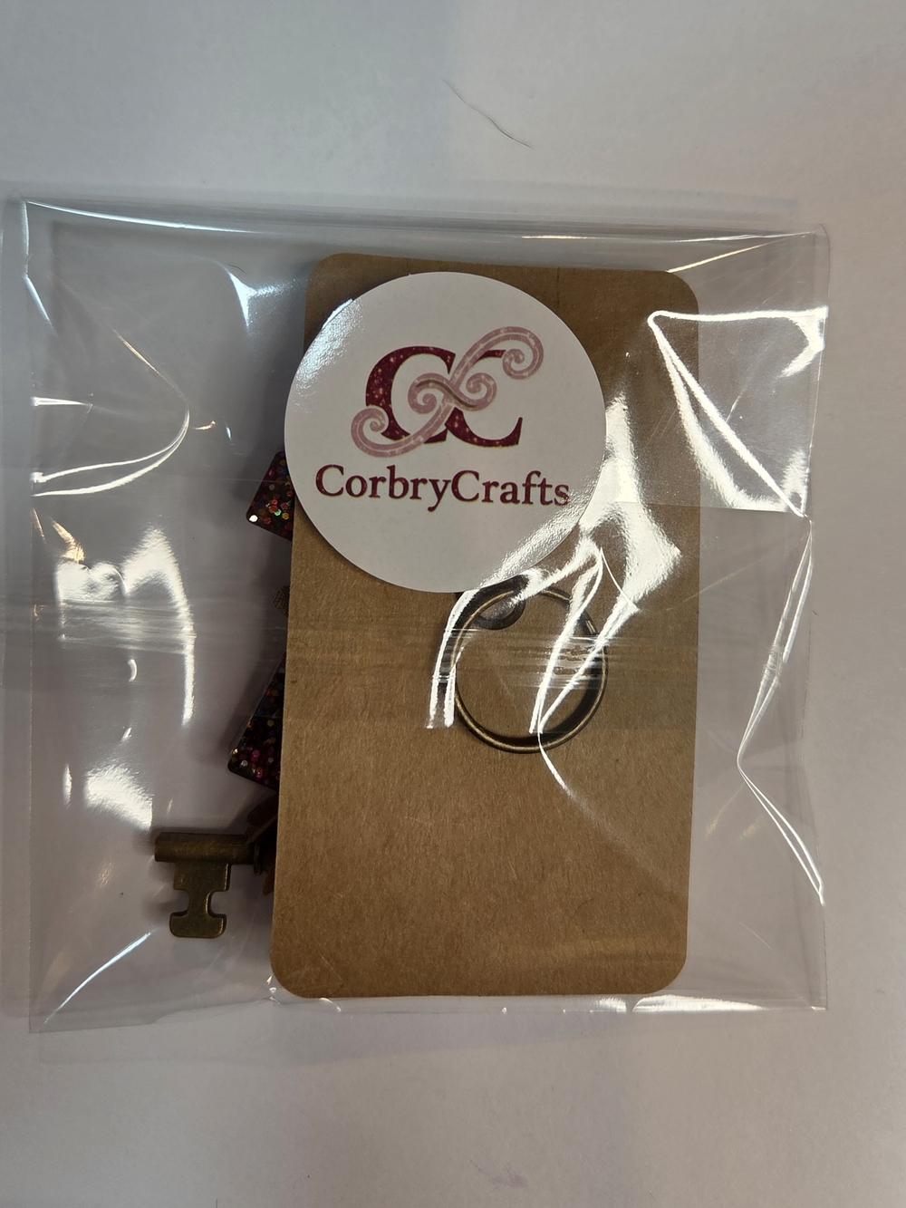 Steampunk-Inspired Brown Resin letter "T" Keychain with Gears, a Key & Tassel - Picture 9 of 9